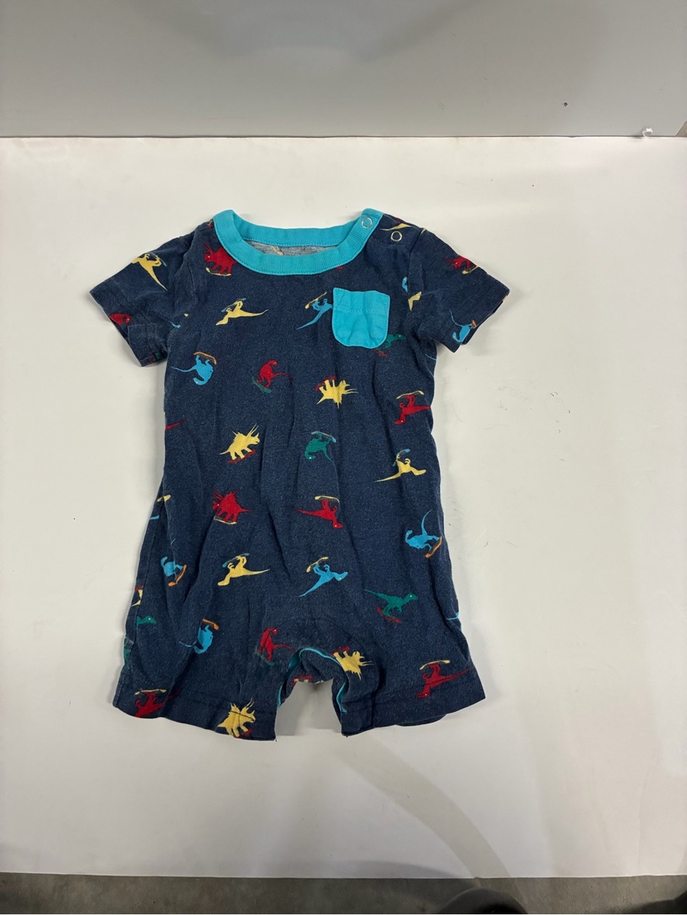 wonder nation Navy Romper with Turquoise Trim and Multicolor Dino Accents